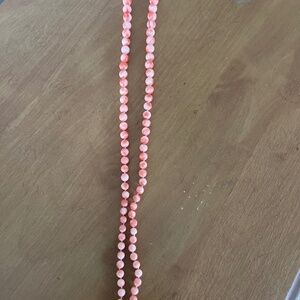 24” hand silk knotted natural hand carved pinkish coral necklace grading size.